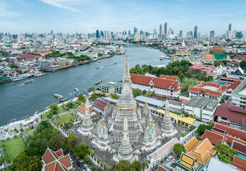 Aerial view of high-rises and Wat Arun along the Chao Phraya River, Bangkok, Thailand © Kevin