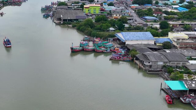 Aerial View of Fishing Boats Moored Along River Estuary Harbor