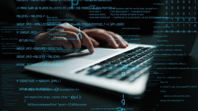 Close-up view of hands typing on a laptop keyboard, surrounded by flowing code and digital data, illustrating modern technology and programming concepts. Xenic