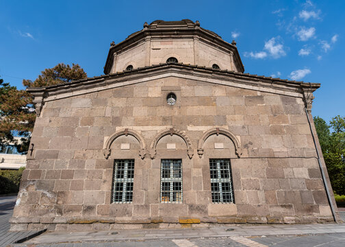 Exterior view of the historic Zeynel Abidin Tomb, also known as Zeynel Abidin Turbesi, featuring traditional stone masonry architecture under a clear blue sky in the city of Kayseri, Turkey