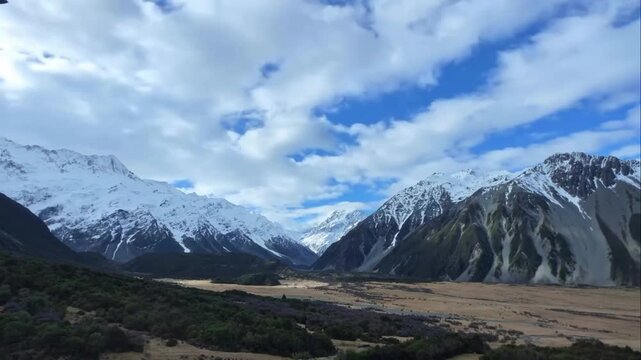 Panoramic view of snow-capped peaks and mountain ranges in New Zealand 