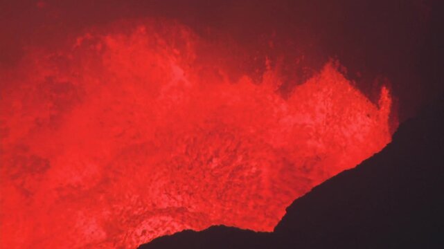 Boiling Lava Lake Glows Inside Crater Of Active Volcano