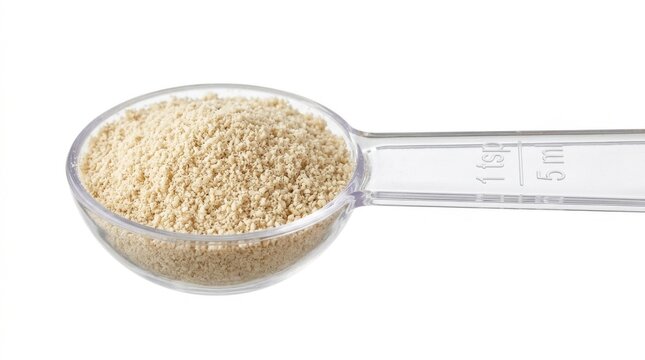 Fine ground sesame seeds in measuring spoon