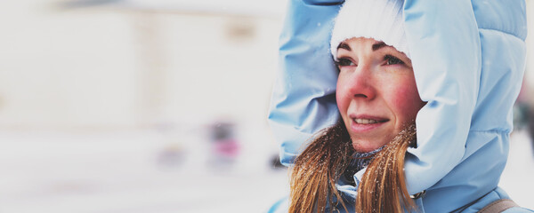 Winter Wanderer Gazes at the Snowy Landscape in a Cozy Hooded Jacket © Aleksandr