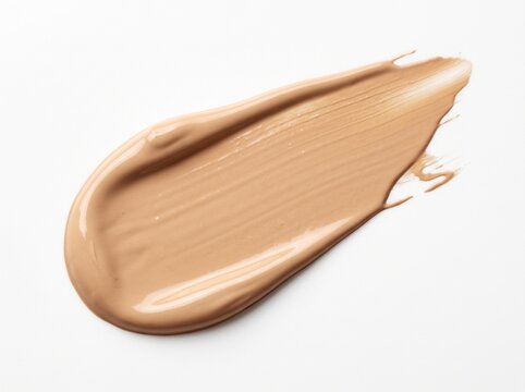 Smooth creamy beige liquid foundation makeup swatch on white background