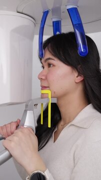 Woman patient undergoing dental panoramic x ray scan