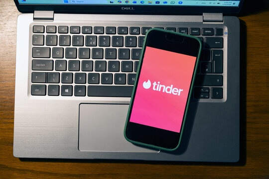 iPhone display with Tinder dating app