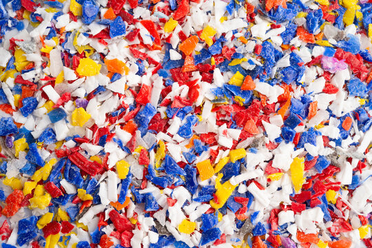 Plastic colorful pieces recycling shredded for industrial use.