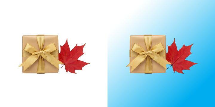 Small gift box with brown paper and gold ribbon next to a red maple leaf for autumn holiday