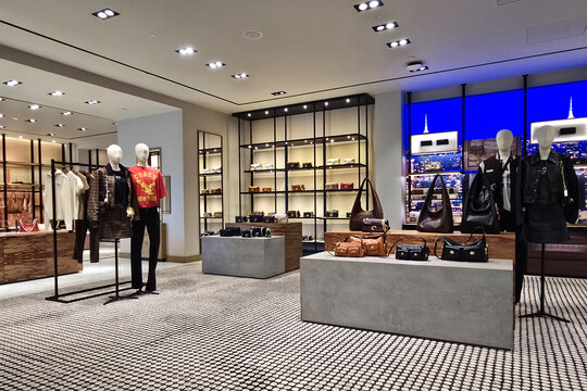 Penang, Malaysia - Sep 06, 2026: Interior view of Coach luxury fashion store showcasing designer leather handbags, accessories, and dressed mannequins inside a shopping mall