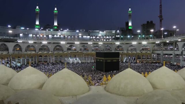 Aerial drone view of the Kaaba surrounded by thousands of pilgrims performing Tawaf at the Grand Mosque in Mecca at night