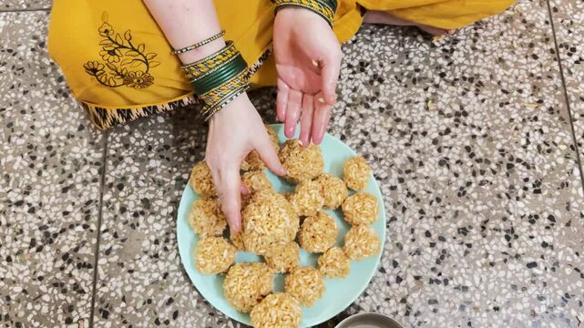 Puffed Rice Ladoo Making Ceremony With Women Preparing Homemade Traditional Sweets