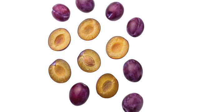 Scattered halves of fresh purple plums pattern isolated on transparent background