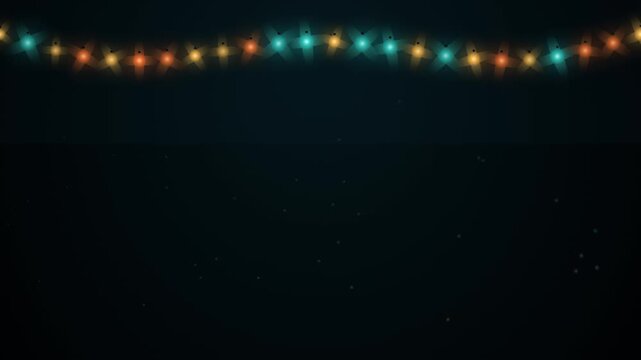 Festive string lights with glowing colorful bulbs on a dark background