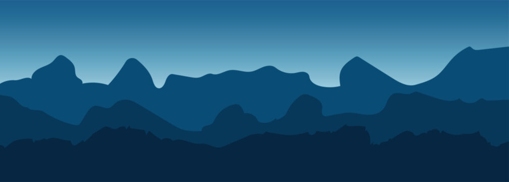 Deep blue layered mountain silhouettes against a gradient sky creating a serene atmospheric landscape background