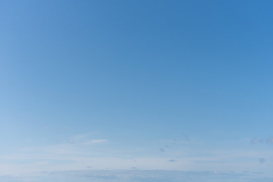 Clear Blue Sky With Faint Clouds Near The Horizon, Minimal Summer Background With Copy Space