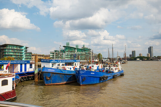 London, England, United Kingdom, August 16, 2026. Thames Marine Services workboats moored along River Thames quay