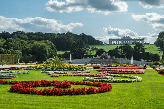 View across Great Parterre garden towards Gloriette hill at Schonbrunn Palace in Vienna, Austria. 19.09.2019