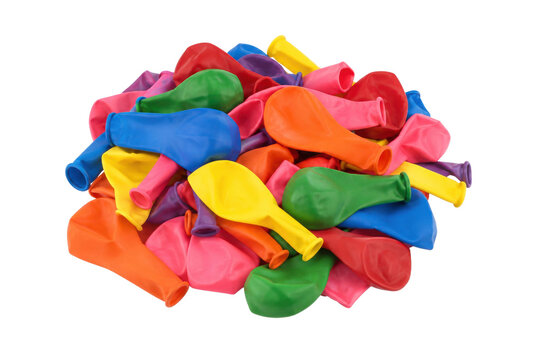 Large pile of colorful deflated rubber balloons creates a vibrant and playful abstract background on a clean white surface
