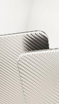 Close-up of carbon fiber weave pattern texture and surface