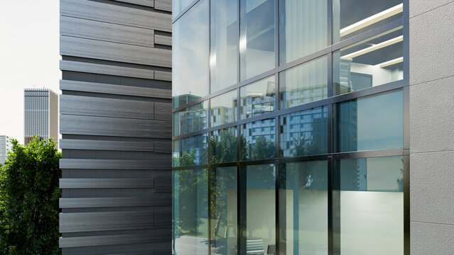 Modern office building with glass windows reflecting urban cityscape