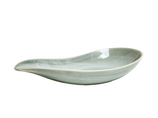 Elegant light green ceramic gravy boat with a smooth, glossy finish and subtle crackle texture on a...