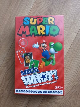 Super Mario Mega Whot card game box featuring iconic Nintendo characters on a red background