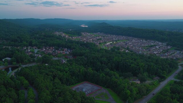 The exurban edge of the Birmingham metro, where new residential construction has filled a valley floor in Shelby County and is working up the slopes toward the ridge. US Highway 280