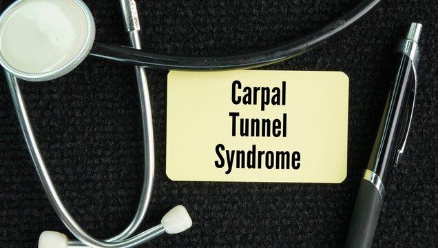 Stethoscope and paper with the word Carpal tunnel syndrome. common medical condition that causes numbness, tingling, pain, and weakness in the hand and wrist due to pressure on the median nerve.