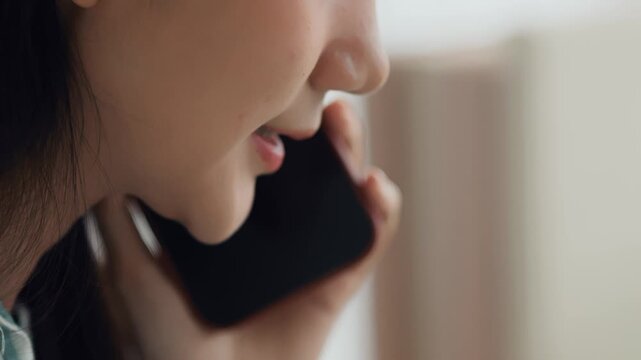 Extreme closeup businesswoman talking on cellphone