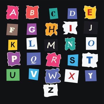 Alphabet letters a-z cutout on torn paper pieces against black background