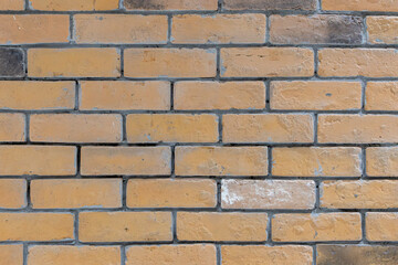 Obraz premium Close Up of Rustic Beige Brick Wall with Gray Mortar