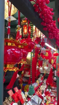 Traditional Chinese festival market featuring red lanterns, cultural decorations and lucky charms