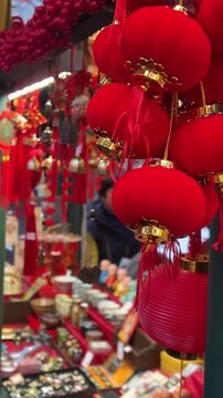 Traditional Chinese festival market featuring red lanterns, cultural decorations and lucky charms
