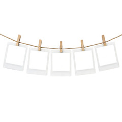 Five blank photo frames hanging on a rope with wooden clips © Raja