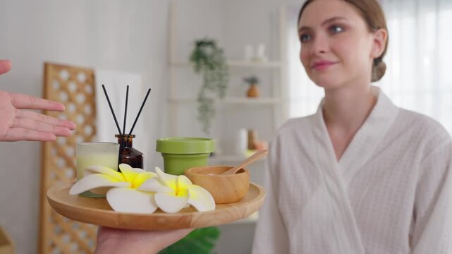 Female masseuse recommending spa treatment to customer at beauty spa salon. 
