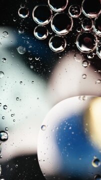 Macro Bubbles Floating in Oil Abstract Background