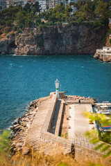Obraz premium Breakwater lighthouse at Kaleici Old Harbor in Antalya on the Mediterranean coast