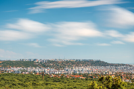 Long exposure Antalya cityscape with flowing clouds viewed from northern hills