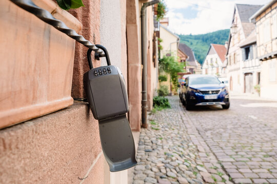 Modern lockbox for apartment keys on street wall