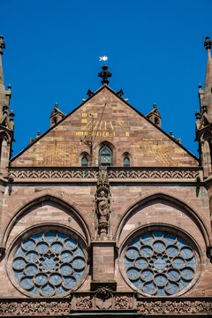 Details of the Strasbourg Cathedral facade against blue sky