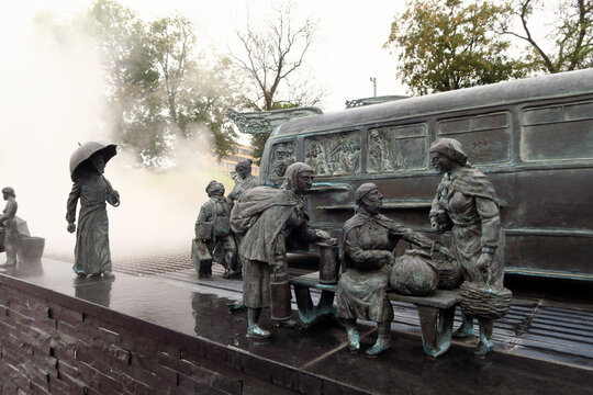 Kielce, Poland.  A sculpture by Sławomir Mick in front of the Kielce train station, featuring, among others, a Jelcz 43, commonly known as the "cucumber"