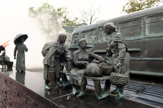 Kielce, Poland.  A sculpture by Sławomir Mick in front of the Kielce train station, featuring, among others, a Jelcz 43, commonly known as the "cucumber"