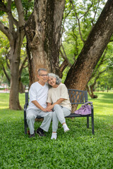 Fototapeta premium Senior Couple Close Portrait Bench Outdoor Park.