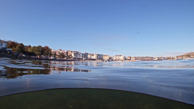 In water split level shot of Swanage seafront in summer