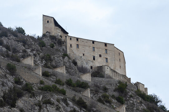The Citadelle d Entrevaux sits atop a rocky hill with fortified walls and zigzag ramps.