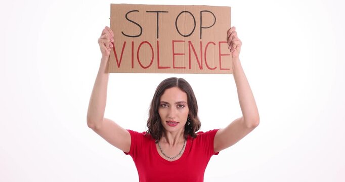 Female activist holds large cardboard sign with phrase Stop Violence. Woman draws attention to urgent need for safer society against white background