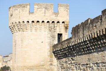 Avignon, France -  A round stone tower and crenellated wall of the Remparts d Avignon medieval fortifications. © LT