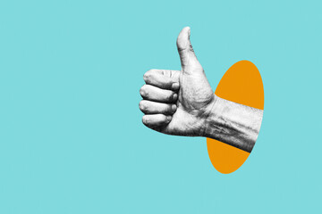 Human hand showing thumbs up gesture on abstract collage background