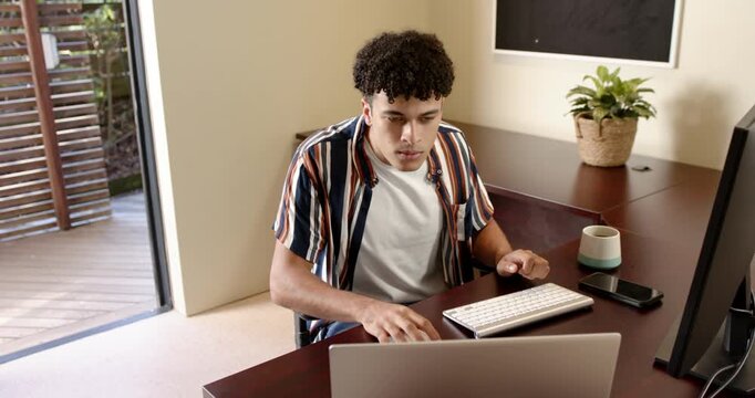 Lifestyle videos indoor of people doing activities at home, typing on keyboard, young man working fr